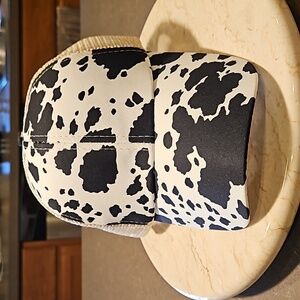 Cow print ponytail trucker hat.